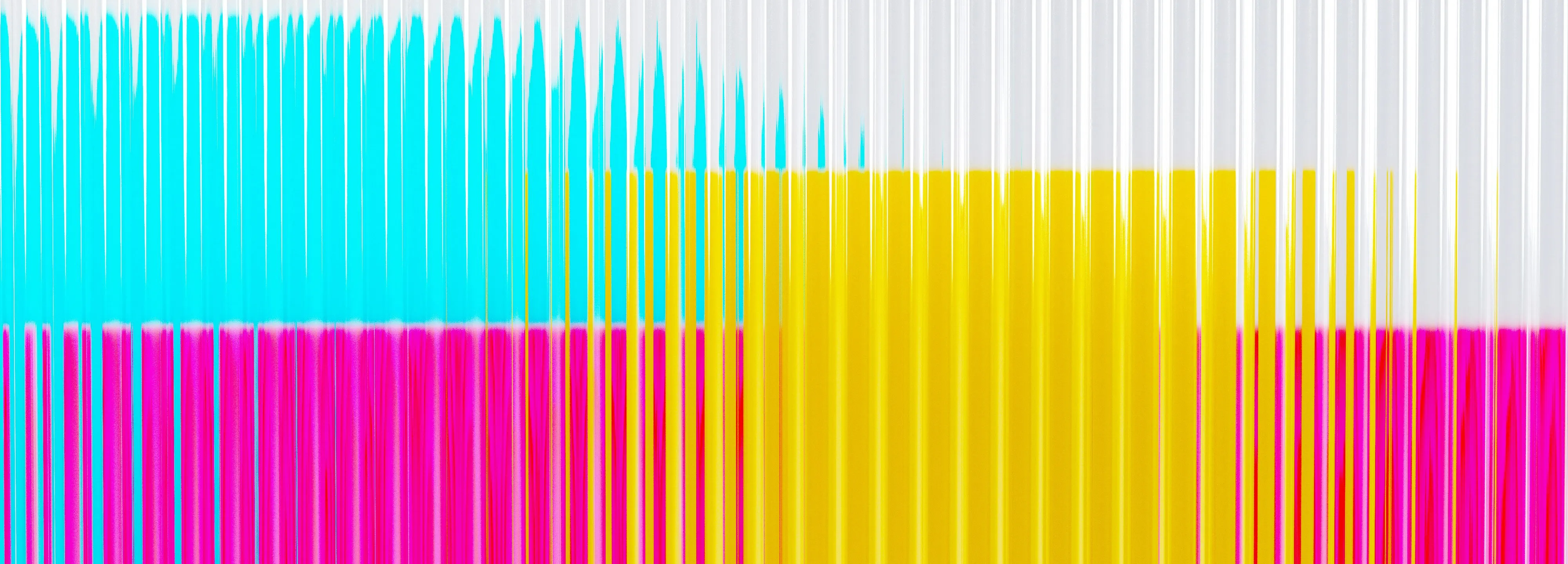 Abstract streaks of cyan, magenta, and yellow ink